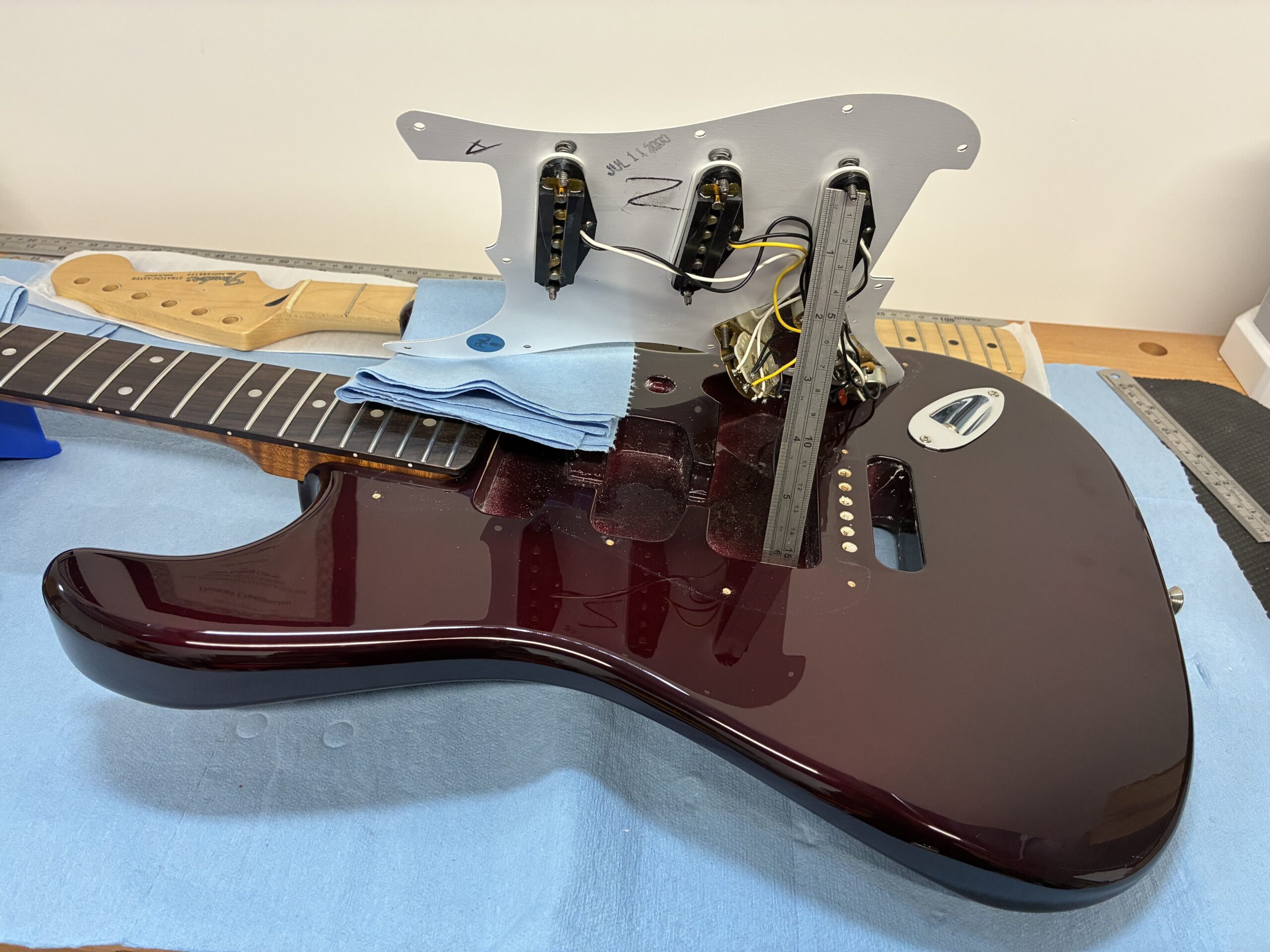 An image showing a guitar repair in the UK in progress