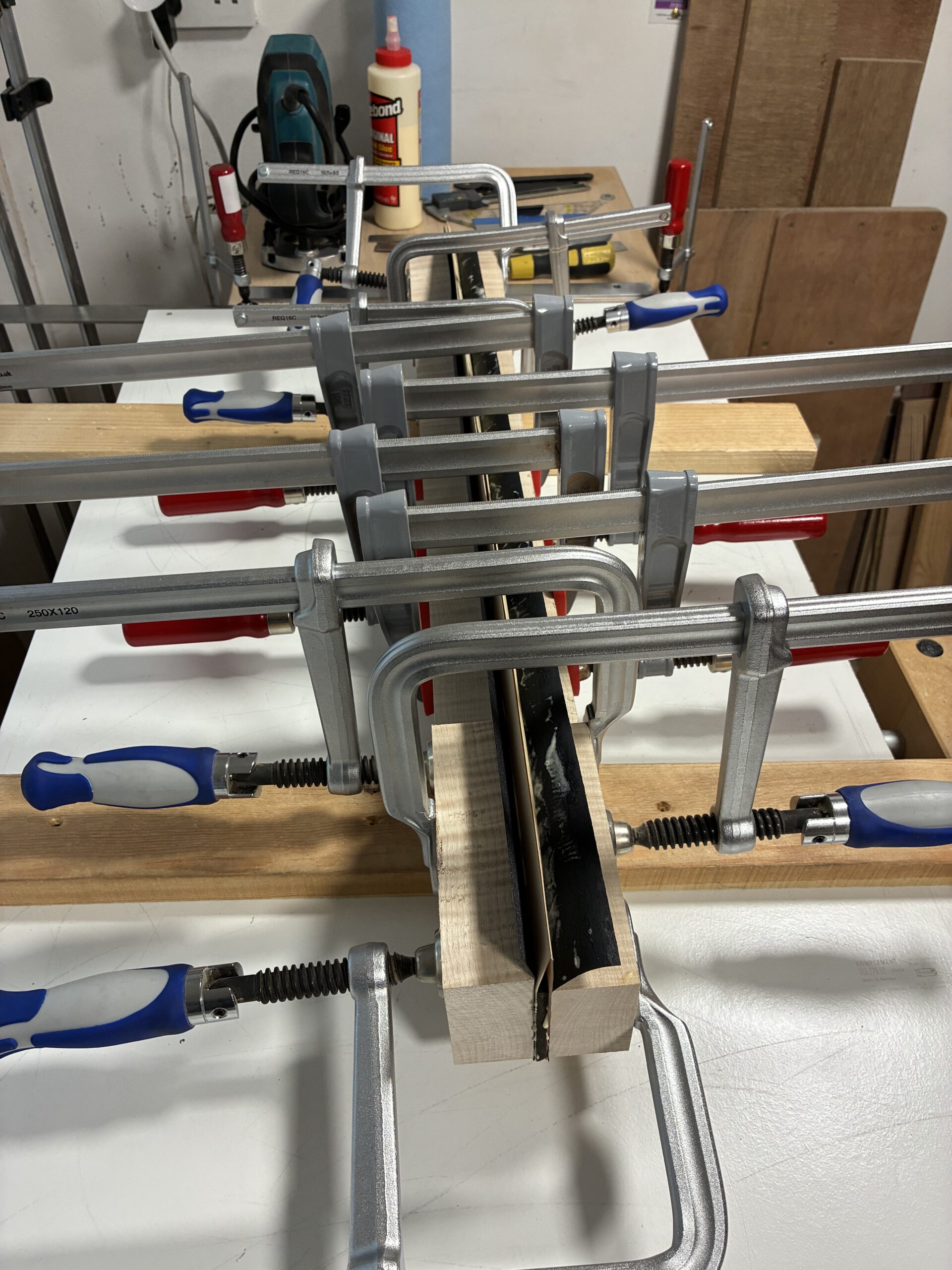 An image showing the build process of a guitar neck