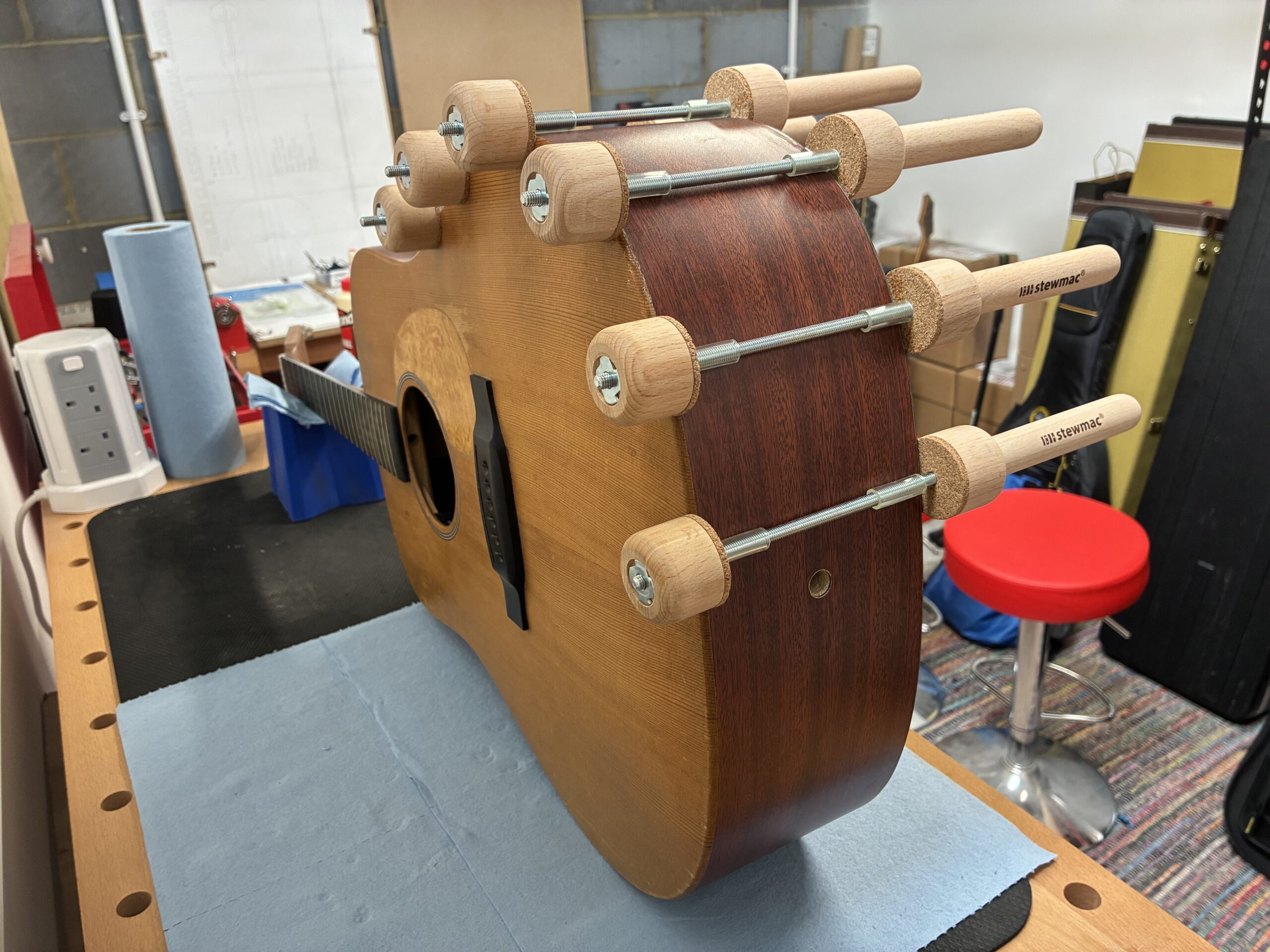 An image showing an acoustic guitar repair in progress